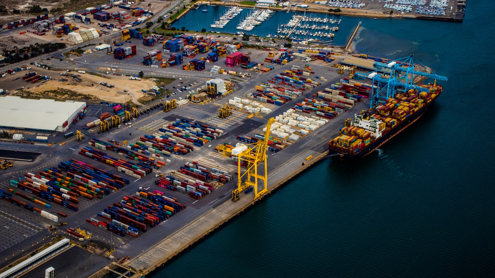 docked shipping ship on body of water