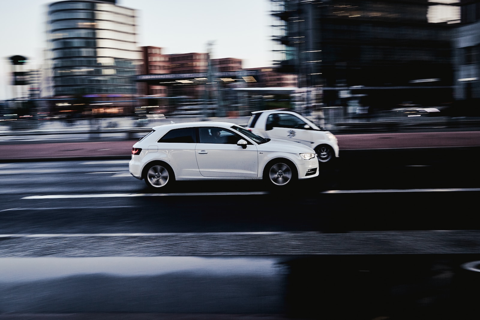 Photo by Marco Lastella white sedan on road during daytime