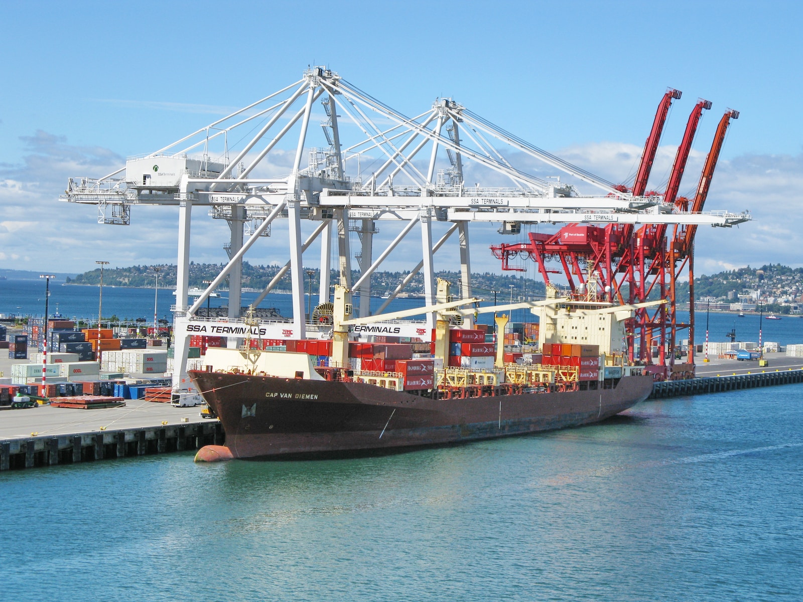 a large cargo ship docked at a dock